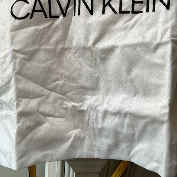 Interior picture of yellow Calvin Klein bag. Noticed flaw on interior - Picture 2 of 9